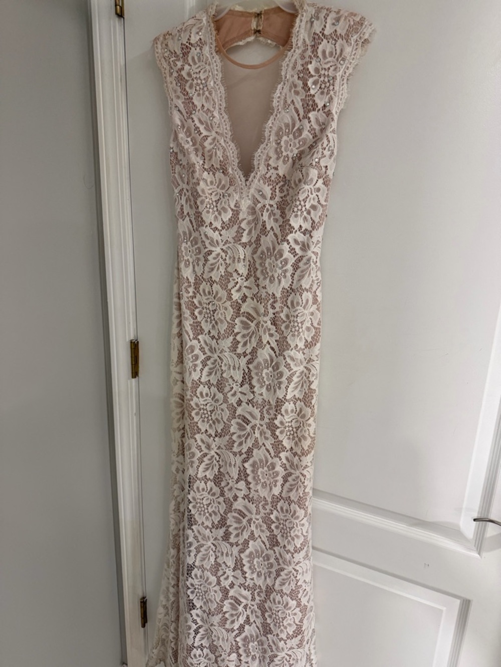 Floor length white lace dress with nude underlay
